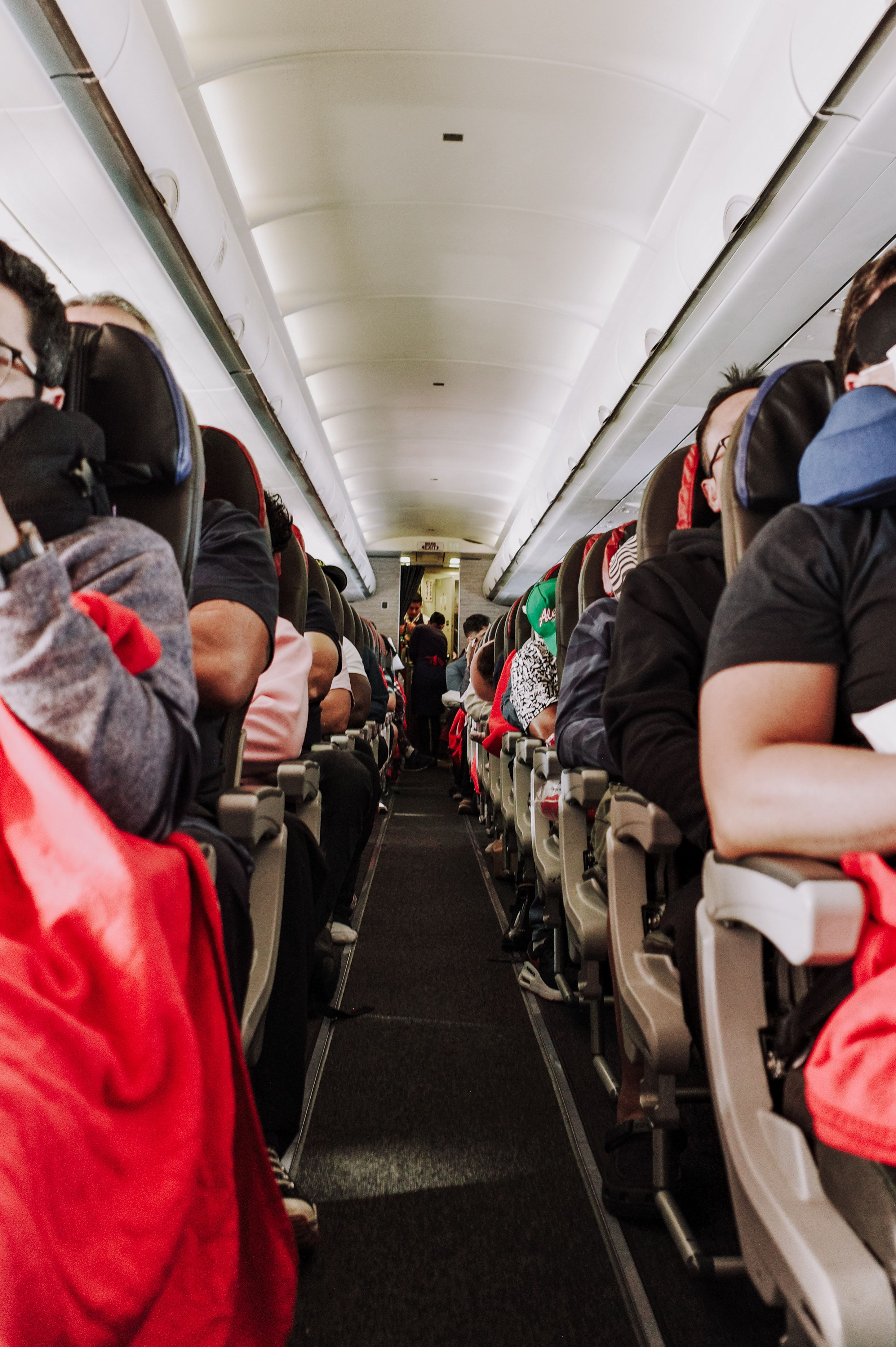 Airplane interior with passengers, highlighting the physical altercation at the airport theme. Airplane interior with passengers, highlighting the physical altercation at the airport theme.