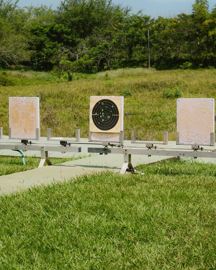 Shooting targets in a grassy field, reflecting American habits related to recreation or sport.