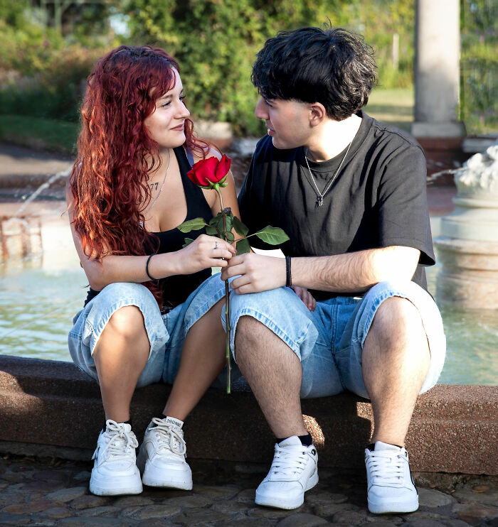 A young couple shares a romantic moment, highlighting modern dating experiences. A young couple shares a romantic moment, highlighting modern dating experiences.