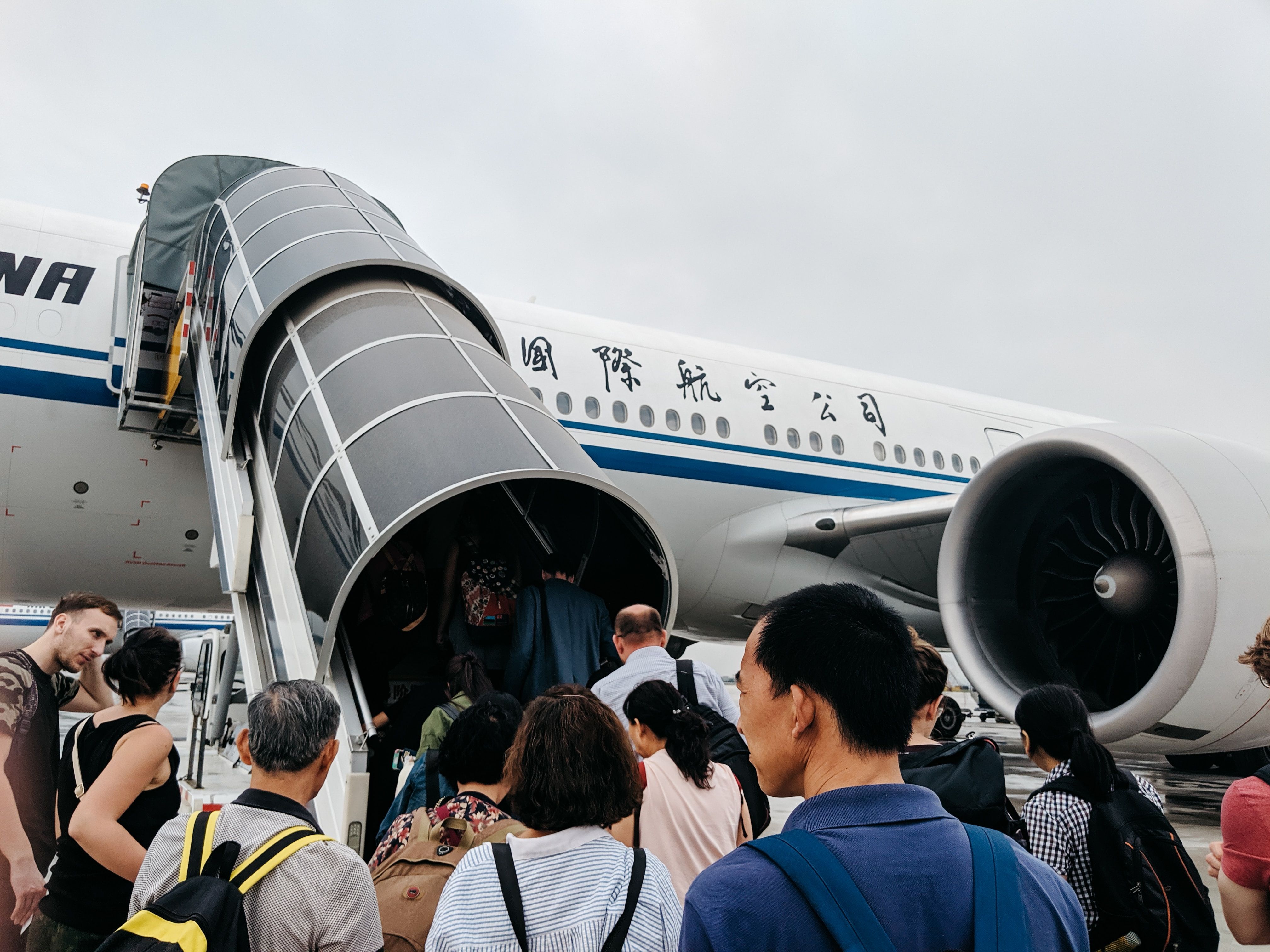 Passengers boarding an airplane at the airport, showing the main keyword physical altercation at the airport. Passengers boarding an airplane at the airport, showing the main keyword physical altercation at the airport.