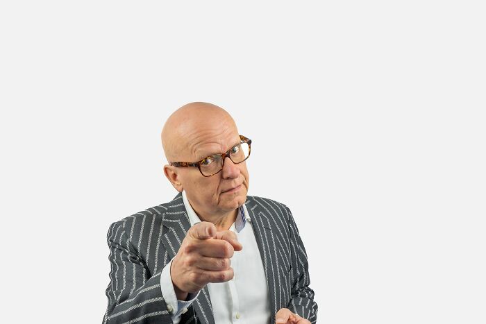 A man points, capturing a moment that cracks people up with his stereotypically white phrases.