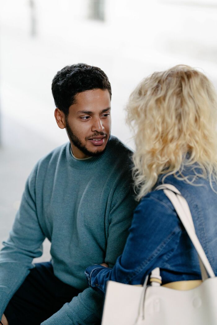 A man looking intently at a woman, symbolizing the unexpected twists and turns that changed people's lives.