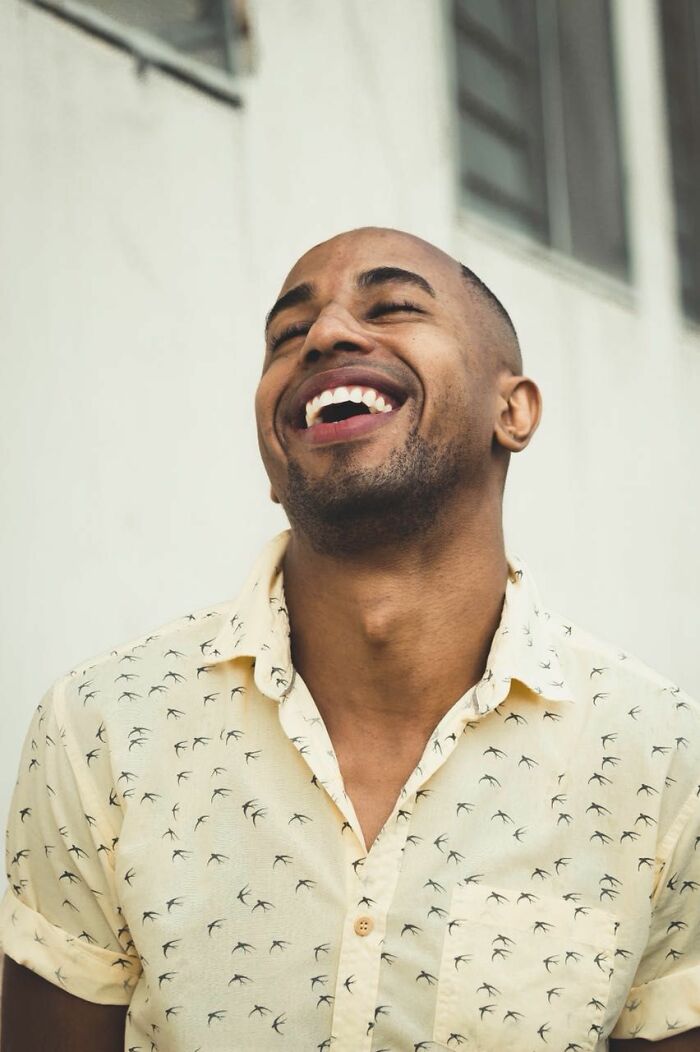 Man laughing, happily following his instincts to get away from deeply evil creeps.