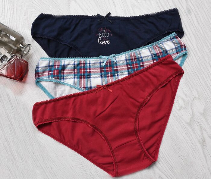 Three pairs of colorful womens underwear. Kids visiting a friend's house might see different clothing as normal.