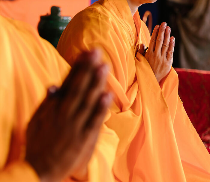 Buddhist monks with hands in prayer position, acknowledging the loss of lives and injuries after the pickup truck incident. Buddhist monks with hands in prayer position, acknowledging the loss of lives and injuries after the pickup truck incident.