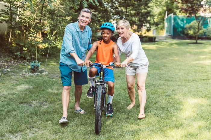A happy family with a boy on a bike, contrasting with a future mother-in-law trying to stop her son from marrying a woman.