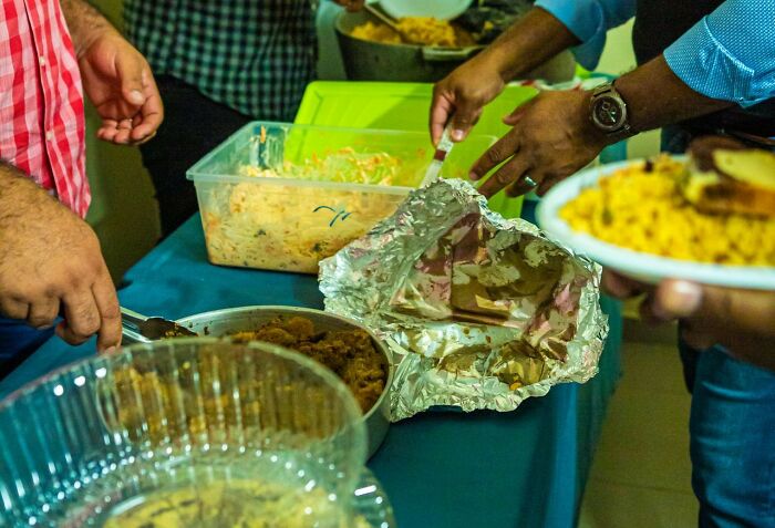 People serving food at a buffet, sharing public horror stories worse than any horror movie.