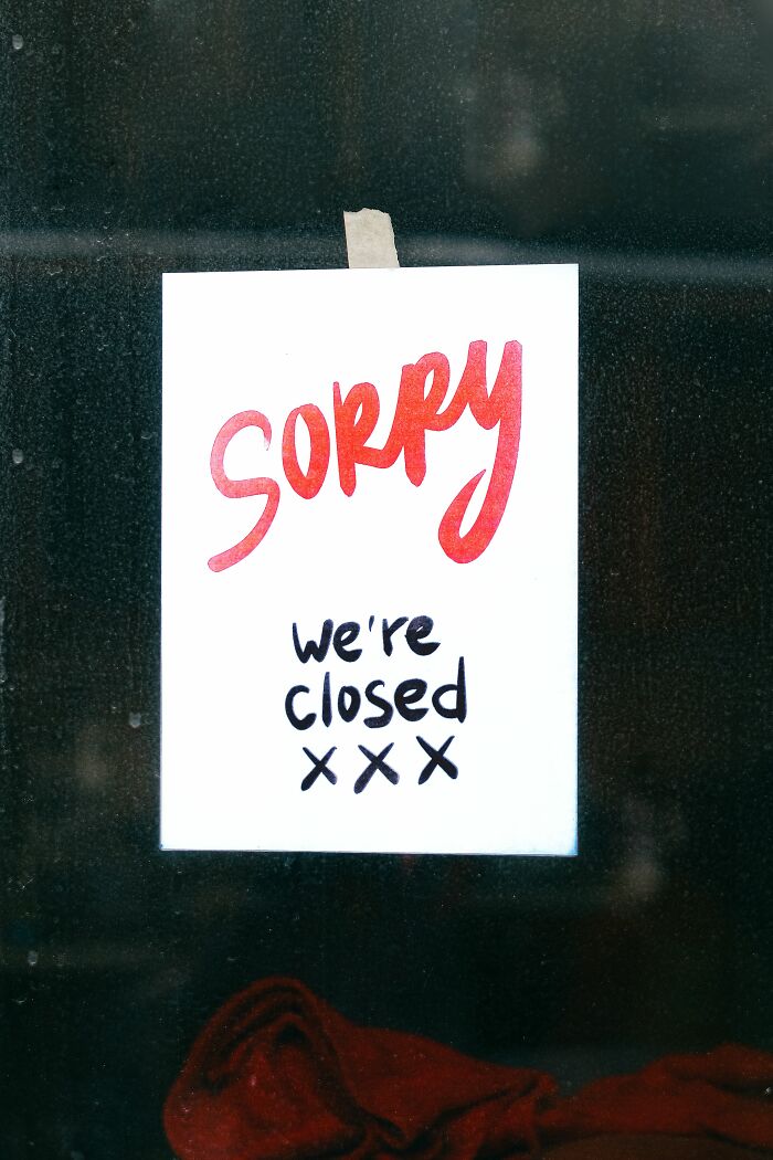 A 'Sorry, we're closed' sign, indicating a place that may have failed health inspections.