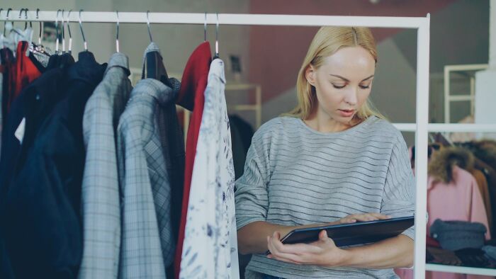 Woman in a store, managing inventory, feeling her instincts about deeply evil creeps.