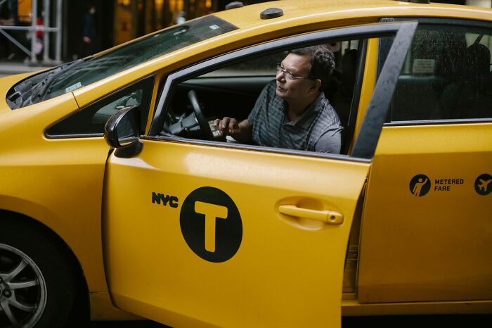 A man in a yellow NYC taxi looks out the window, revealing secrets people weren't supposed to know.