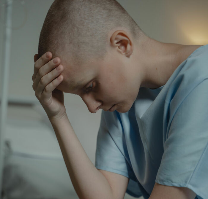 Sad girl with cancer, reflecting on the profound impact of mistreatment and the need for support. Sad girl with cancer, reflecting on the profound impact of mistreatment and the need for support.