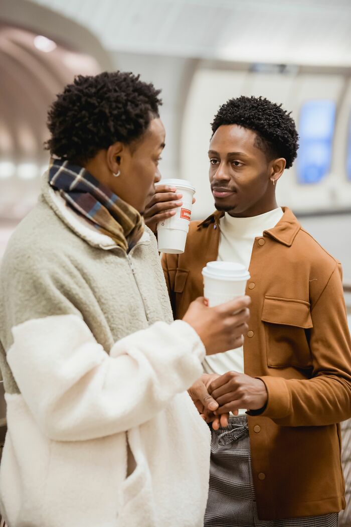 Two men conversing over coffee, highlighting the importance of communication before getting married.