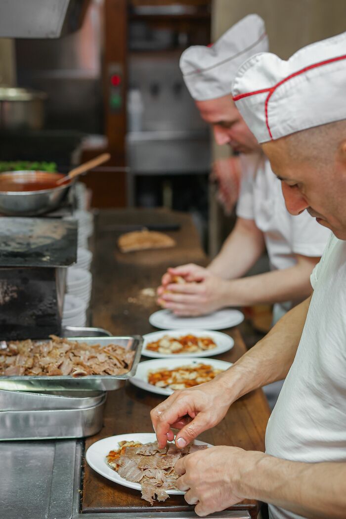 Chefs in a kitchen preparing food, showcasing the industry secrets of culinary jobs.