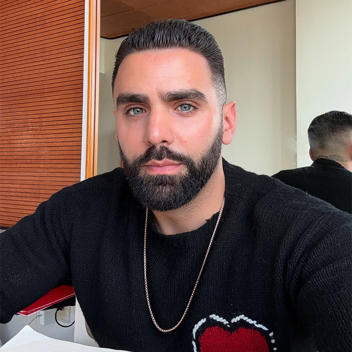 A man with a beard and dark hair wearing a black sweater. Playboy sold out after a rebranding and makeover of bunnies. A man with a beard and dark hair wearing a black sweater. Playboy sold out after a rebranding and makeover of bunnies.