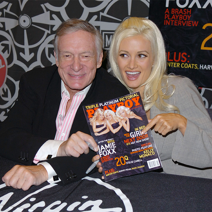 Hugh Hefner and a Playboy Bunny posing with a Playboy magazine after its rebranding and makeover. Hugh Hefner and a Playboy Bunny posing with a Playboy magazine after its rebranding and makeover.