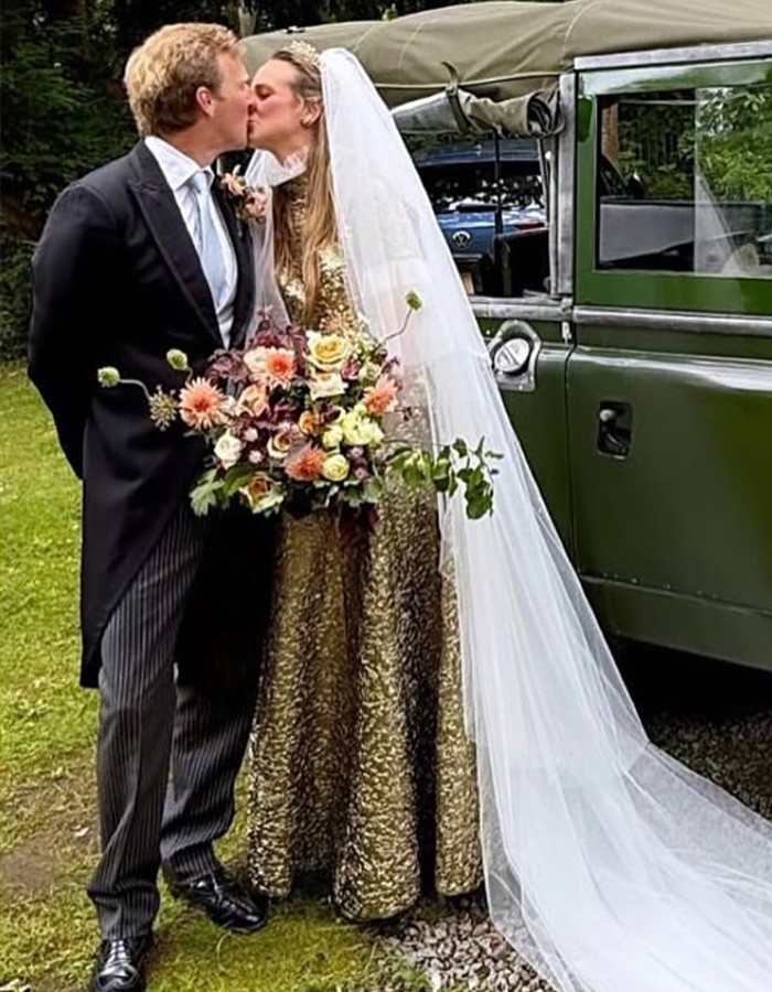 A newlywed couple sharing a kiss beside a vintage car at their fairytale wedding, full of romance. A newlywed couple sharing a kiss beside a vintage car at their fairytale wedding, full of romance.