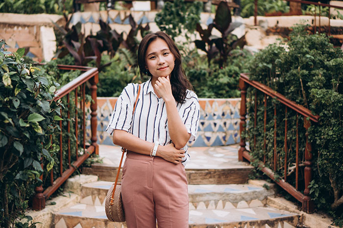Mixed-race mom posing happily outdoors, contemplating family scandals for fun and avoiding explaining her blue-eyed kid. Mixed-race mom posing happily outdoors, contemplating family scandals for fun and avoiding explaining her blue-eyed kid.