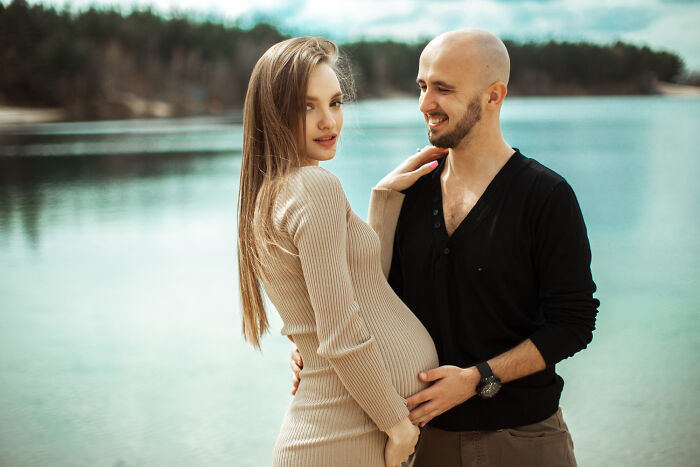 A couple, a man and a pregnant woman, with the woman having great hair, highlighting ignored red flags.