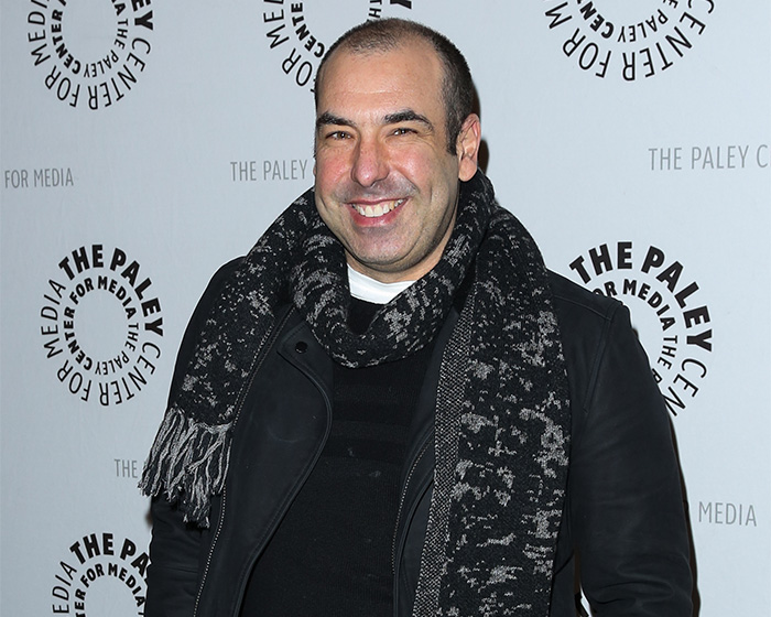 A major Hollywood star, smiling on the red carpet, showing his unrecognizable look, wearing a scarf. A major Hollywood star, smiling on the red carpet, showing his unrecognizable look, wearing a scarf.