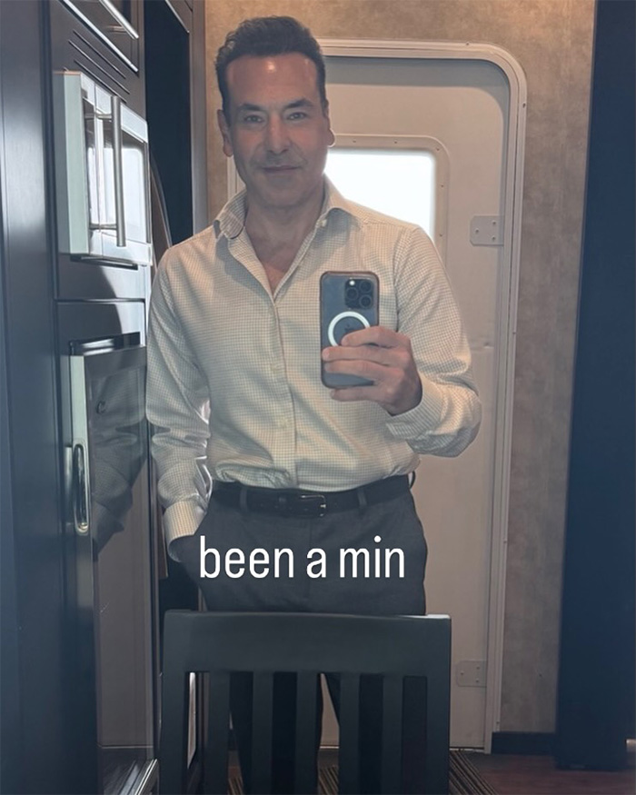 A major Hollywood star taking a selfie, showing his unrecognizable look in a mirror. A major Hollywood star taking a selfie, showing his unrecognizable look in a mirror.