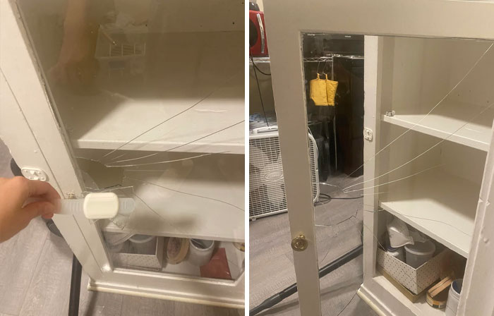 Someone trying to fix things, a cracked glass cabinet door with visible damage and a hand trying to fix it.