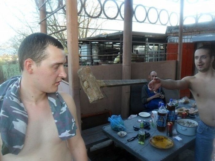 Hilarious photo of a man looking left as a hammer flies past his head moments before disaster struck.