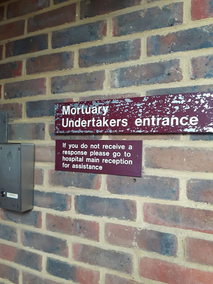 A sign for the Mortuary Undertakers entrance, hinting at the gravity of medical mistakes and their consequences.