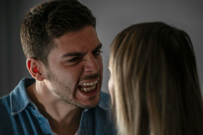 A man shouting intensely at a woman, depicting psycho moments from partners.