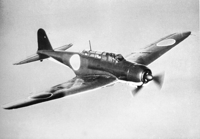 A vintage military aircraft in flight, illustrating an interesting history fact about aviation or warfare.