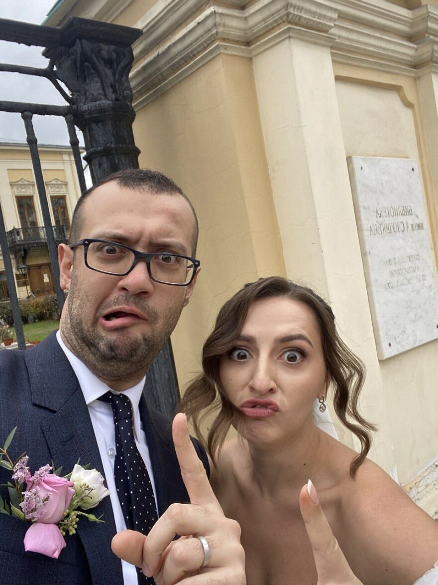 A funny wedding photo of a couple making silly faces at the camera.