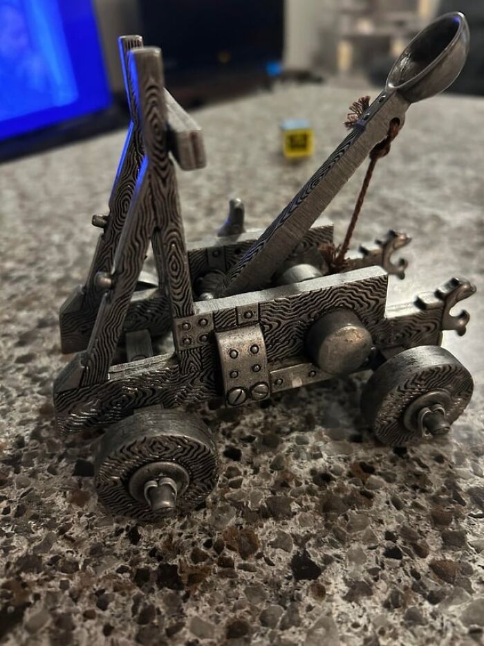 A miniature catapult, symbolizing the ridiculous problems HR has to deal with.