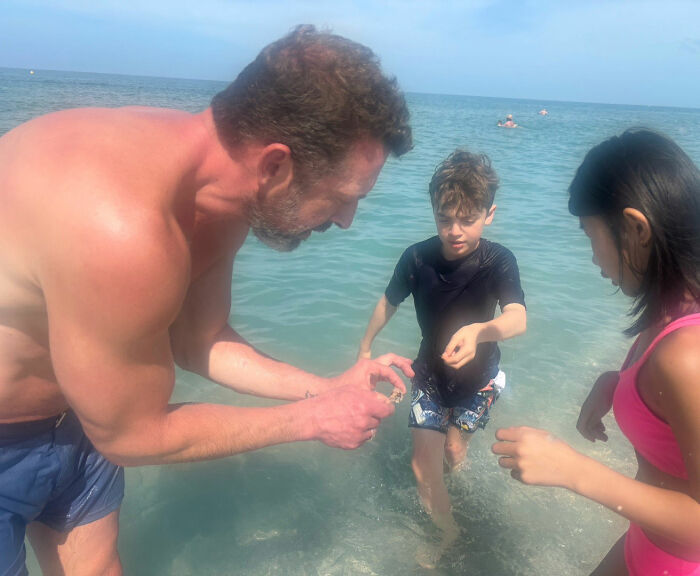 The Michigan man enjoying a beach day with his family, prior to the tragic events.