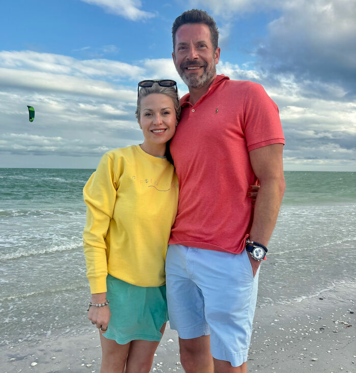 A Michigan man and his wife pose happily on a beach before their family tragedy, highlighting the deceptive calm before the storm.