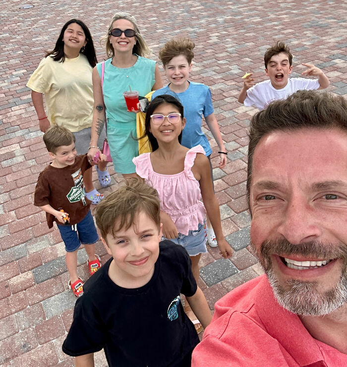 A Michigan man taking a selfie with his family, connected to Reddit posts and a family tragedy.