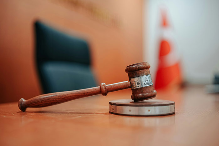 A judge's gavel on a wooden desk, symbolizing the justice and instant karma experienced by divorce lawyers.