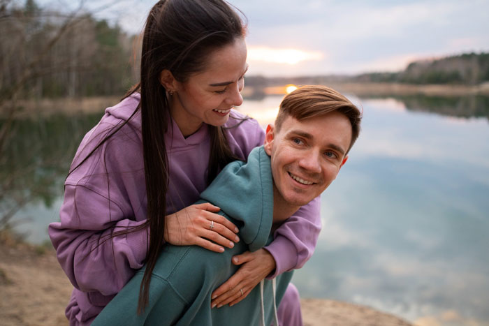 A happy couple by a lake, representing a positive relationship contrasted with the issues of a spy camera and step-dad. A happy couple by a lake, representing a positive relationship contrasted with the issues of a spy camera and step-dad.