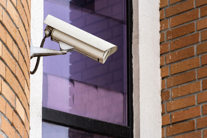 A spy camera, mounted outside a building, potentially overlooking a room. This spy camera was installed by a step-dad. A spy camera, mounted outside a building, potentially overlooking a room. This spy camera was installed by a step-dad.