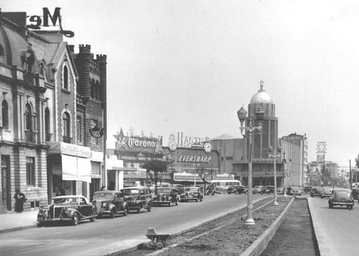 Old street scene with vintage cars and buildings, setting the mood for a national nightmare's chilling events. Old street scene with vintage cars and buildings, setting the mood for a national nightmare's chilling events.