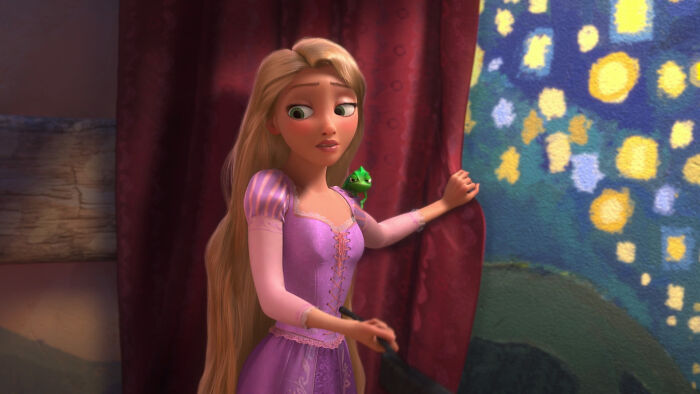 An animated Disney princess with long blonde hair, a purple dress, and a small green chameleon on her shoulder. Disney princess remake. An animated Disney princess with long blonde hair, a purple dress, and a small green chameleon on her shoulder. Disney princess remake.
