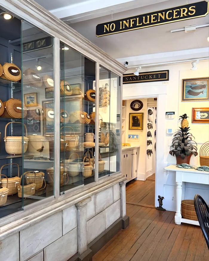 Nantucket store interior with no influencers sign and wicker baskets on display