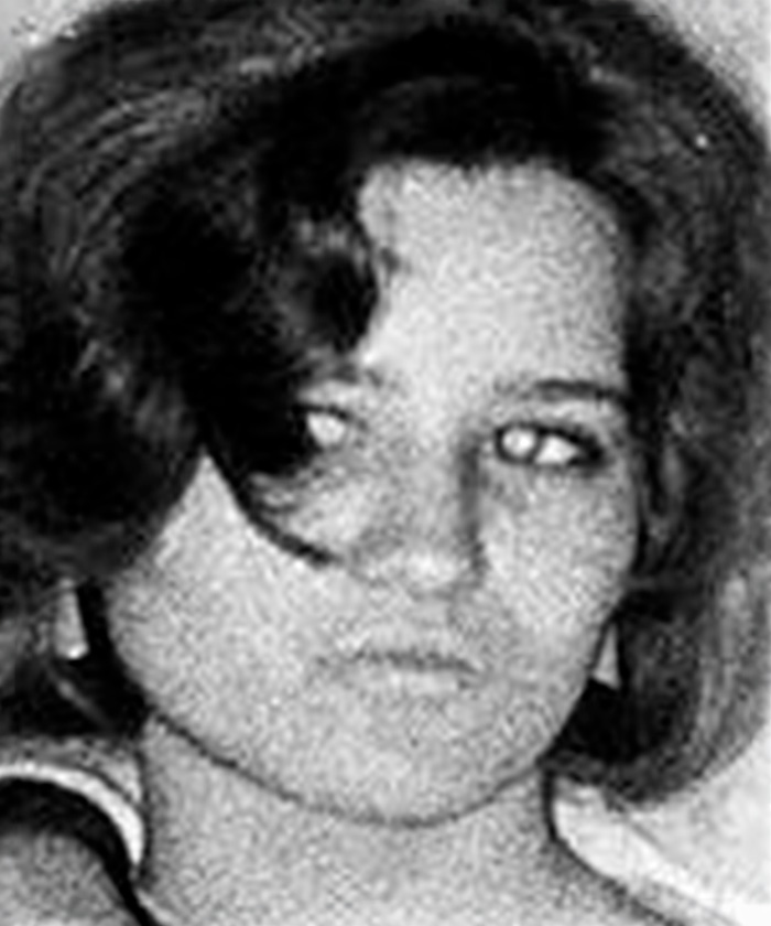 Black and white close-up photo of a woman, evoking fear experienced by women near Britains railway stations.
