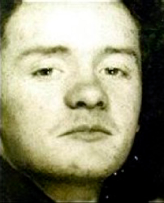 A close-up mugshot of a man with short dark hair, evoking fear among women near Britain's railway stations.