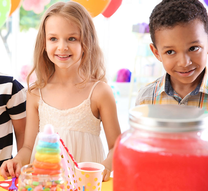 Two happy kids at a birthday party, unaware of a stepmom who tried to hijack the kid's birthday. Two happy kids at a birthday party, unaware of a stepmom who tried to hijack the kid's birthday.