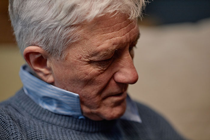 Close-up of an older man with gray hair, representing the dad in the story of the stepmom hijacking the birthday party. Close-up of an older man with gray hair, representing the dad in the story of the stepmom hijacking the birthday party.