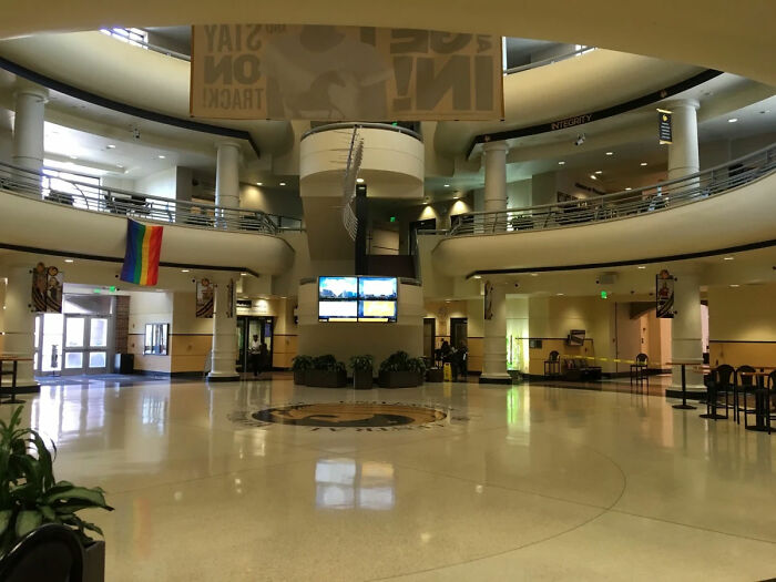 Empty university lobby with a rainbow flag, context for the Trans Florida student incident. Empty university lobby with a rainbow flag, context for the Trans Florida student incident.