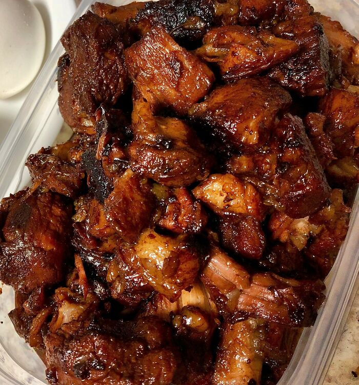 A container of stewed meat, a common meal for international partners experiencing culture shocks.