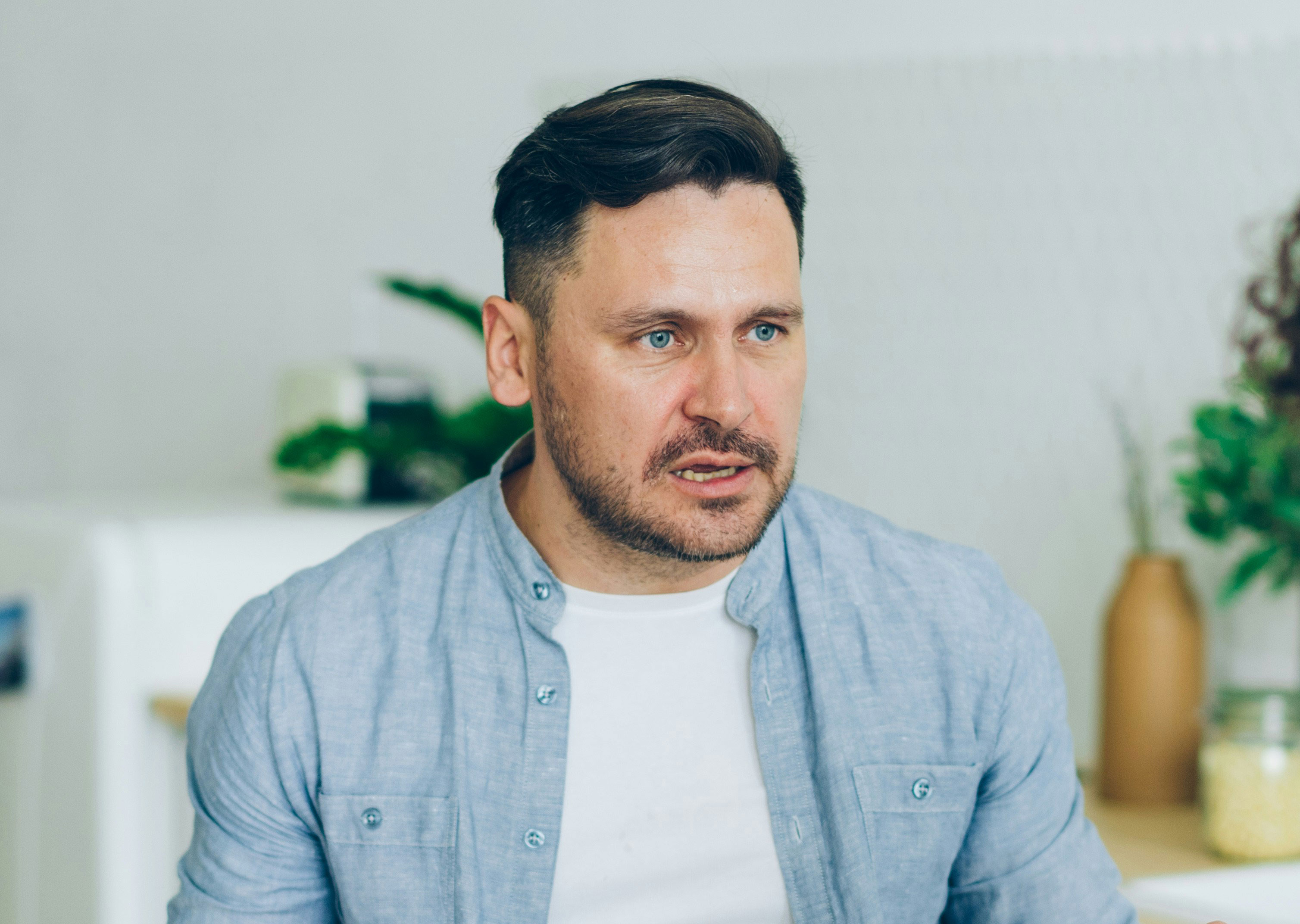 Man looking concerned, contemplating his Aunt's unannounced demand for housing.