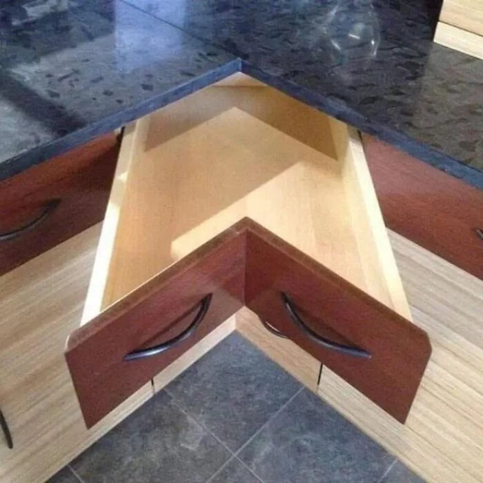 A corner kitchen drawer that opens into a V-shape, a clear example of construction fails.