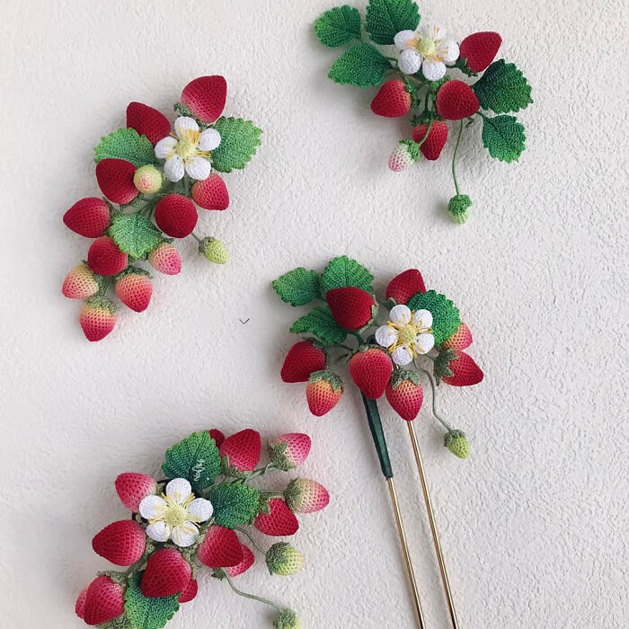Three crochet strawberry creations, including hairpins, displaying useful DIY crochet.