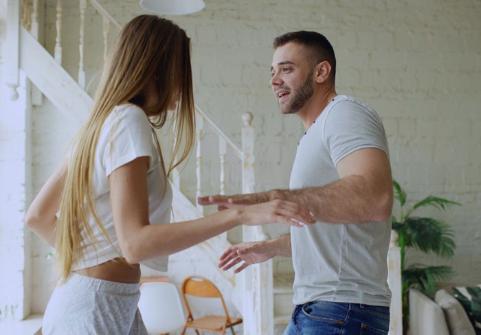 A young woman and man, possibly the DIL and husband, in a casual setting, discussing the plan to have kids.